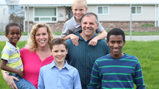 A diverse family smiling