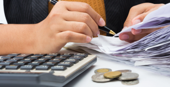 Accountant checking recipts.