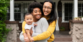 Multiethnic family standing at the porch during covid19 lockdown