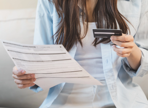 Header - Child Support Distribution Woman receiving debit card in mail