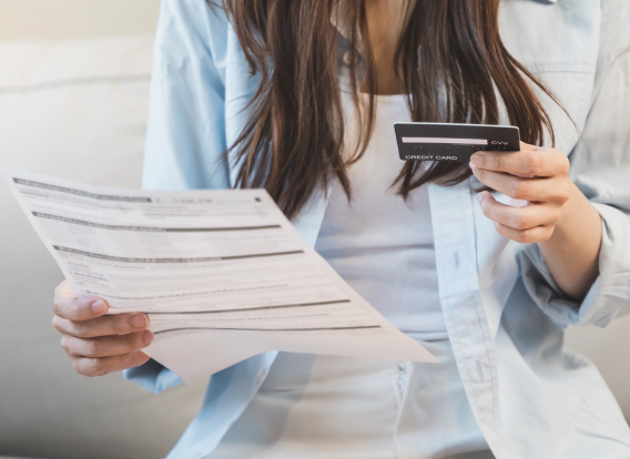 Woman receiving debit card in mail