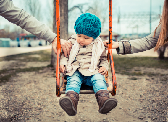 Header - Child Support Obligations Child sitting on swing